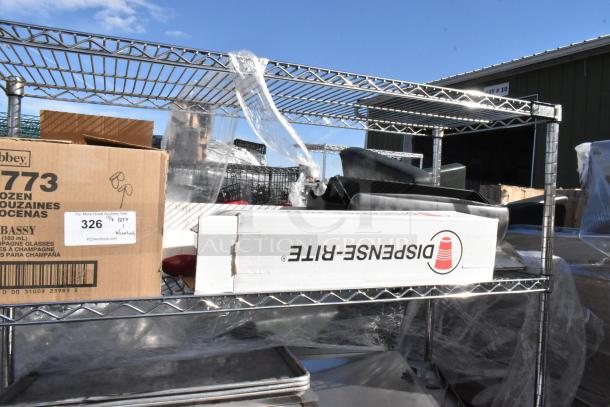 Chrome finish 4-tier wire shelving unit with contents including Dispens-Rite box and other items. Buyer must dismantle.