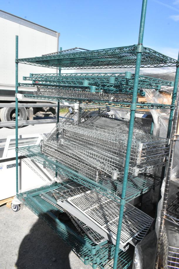 Green 4-tier wire shelving unit on commercial casters, includes wire shelves, requires buyer dismantling, freight charges apply.