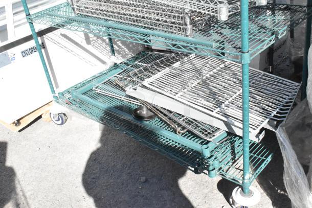 Green finish 4-tier wire shelving unit on commercial casters, includes wire shelves. Buyer must dismantle.