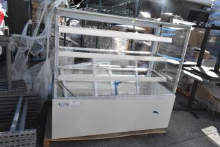Avantco 193BCFD60W 59" white bakery display case with LED lighting, new condition, 110-120 volts, on a pallet.
