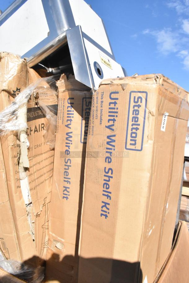 Cardboard boxes labeled "Steelton Utility Wire Shelf Kit" with visible damage, part of a 15-item scratch and dent auction lot.