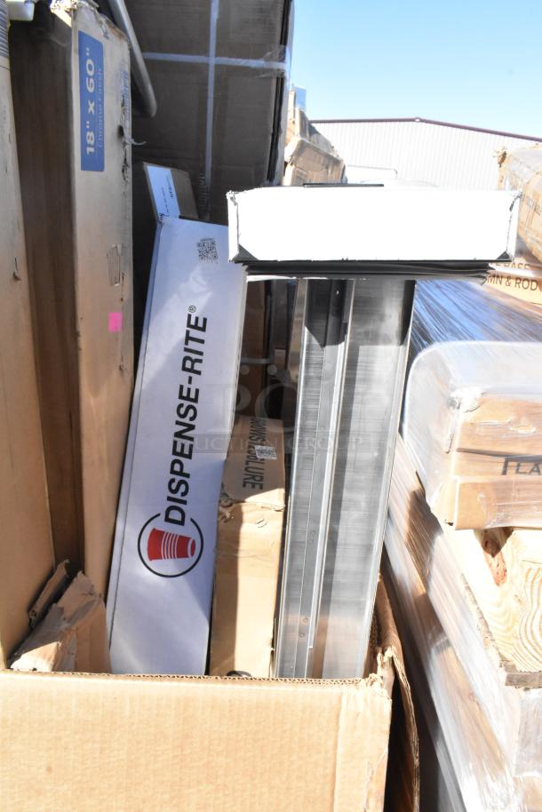 Pallet with various new boxed items, including Dispense-Rite and 18" x 60" shelf packaging, assorted equipment.