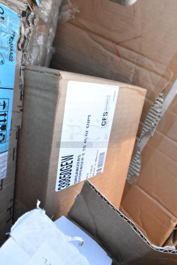 Cardboard box labeled "CFS Brands Organizers, Dispenser 8 to 46 Oz Cups," part of a scratch and dent auction lot.