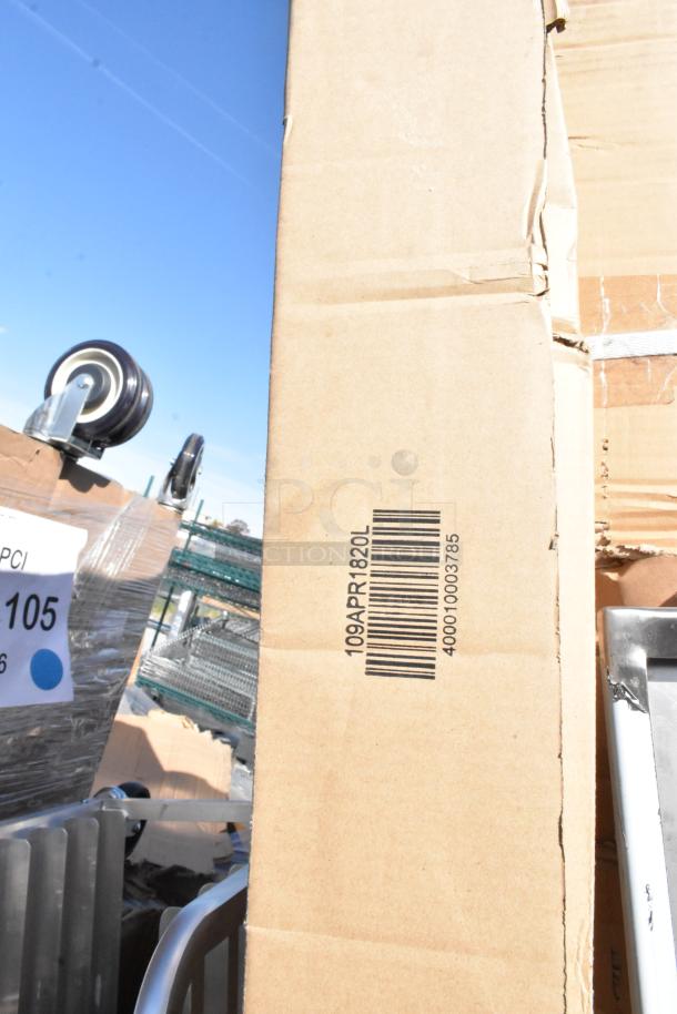 Cardboard box marked "109APR1820L" with barcode, part of auction lot including Lancaster outdoor table and Regency pot rack.