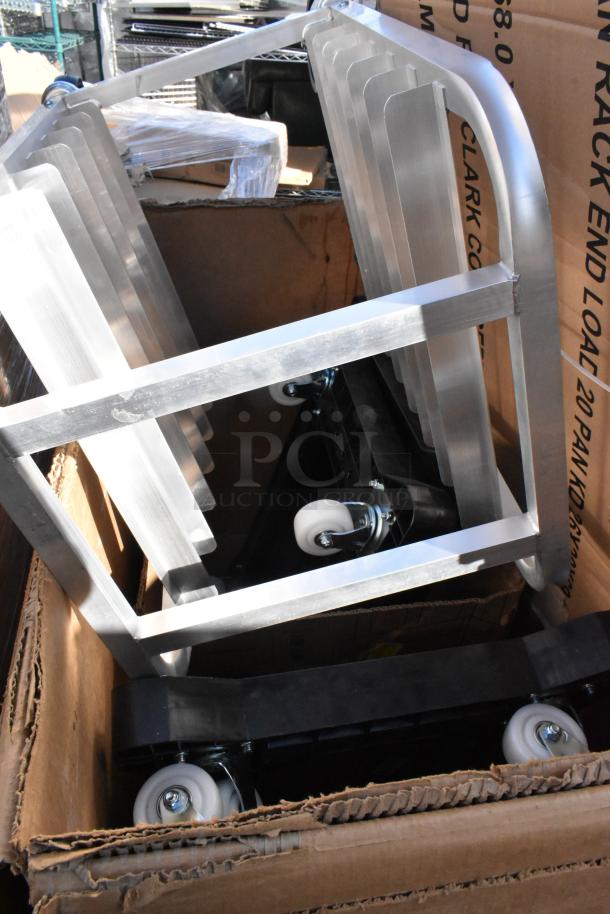 Box containing unassembled Regency 20 Pan End Load Bun/Sheet Pan Rack with casters. New condition, scratch and dent sale.