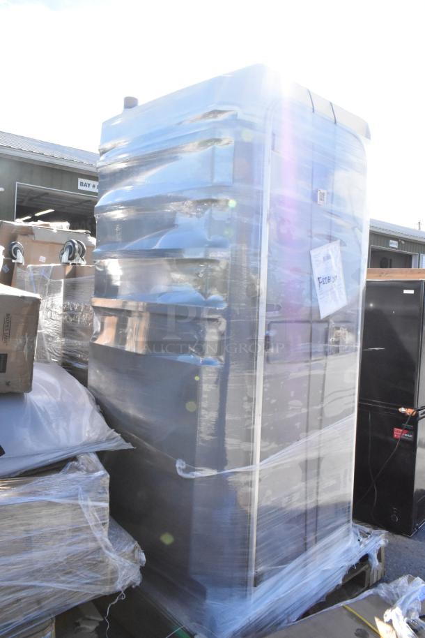 Gray Port-a-Potty, brand new, wrapped in plastic, visible scratches and dents. Shipping label attached.