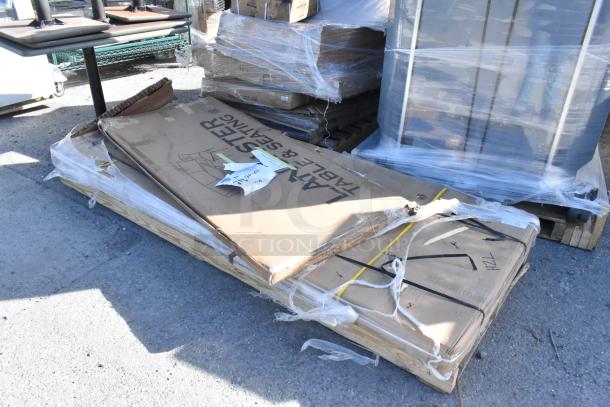 Brand new scratch and dent 600TS3696S Regency 36" x 96" stainless steel work table and 384YCZ7230 Lancaster folding table in packaging.