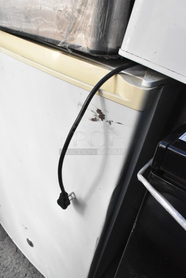 Three mini coolers, including Nostalgia IRF32BK and Haier HSA02WNDWW. 115 volts, 1 phase, visible wear and scratches.