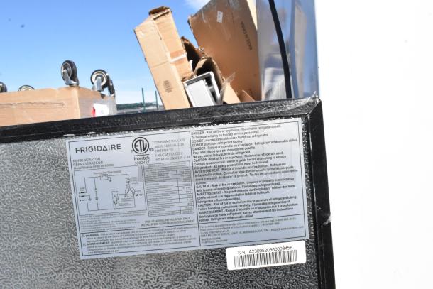 Four mini coolers including Galanz GLR31TS1B02, Frigidaire EFR451-B-6COM, Arctic King, 115V, 1 phase, labeled and boxed.