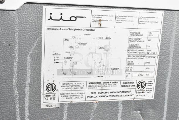 Label of iio refrigerator-freezer showing electrical wiring diagram, model number, rated voltage, and refrigerant details.