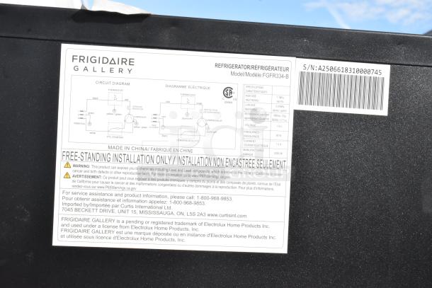 Label on Frigidaire FGFR334-B cooler shows circuit diagram, installation warning, and specs; 115V, 1-phase.