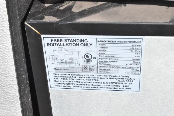 Label on Black & Decker BCE46B cooler showing model details: 4.52 cu.ft, 115V, refrigerant R134a, dimensions, compliance info.