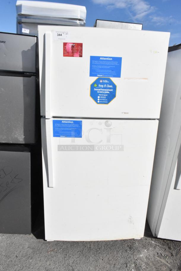 Whirlpool WRT511SZDW00 white refrigerator with top freezer, 115V, used condition. Displayed with safety notices.
