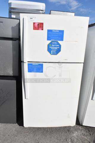 Whirlpool WRT511SZDW00 white refrigerator with top freezer, 115V, used condition. Displayed with safety notices.