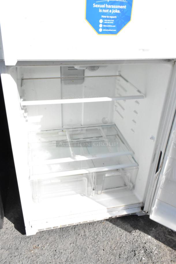 Whirlpool WRT511SZDW00 reach-in cooler with freezer, 115V, 1-phase, glass shelves, and spacious interior.