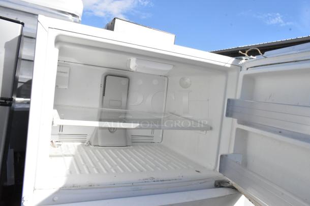 Whirlpool WRT511SZDW00 reach-in cooler with freezer, model visible. Good condition, 115 volts, 1 phase.