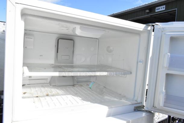 Whirlpool WRT511SZDW00 reach-in cooler with freezer, 115 volts, 1 phase, shown open and empty, minor stains visible.