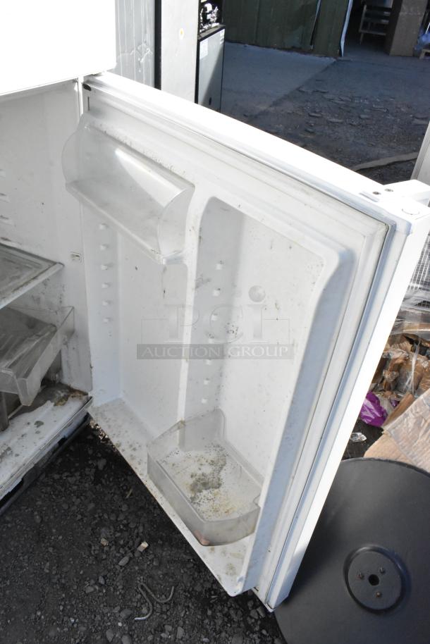 Whirlpool WRT511SZDW00 Reach In Cooler w/ Freezer, open door view. Interior shows shelves, some dirt visible. 115V, 1 Phase.