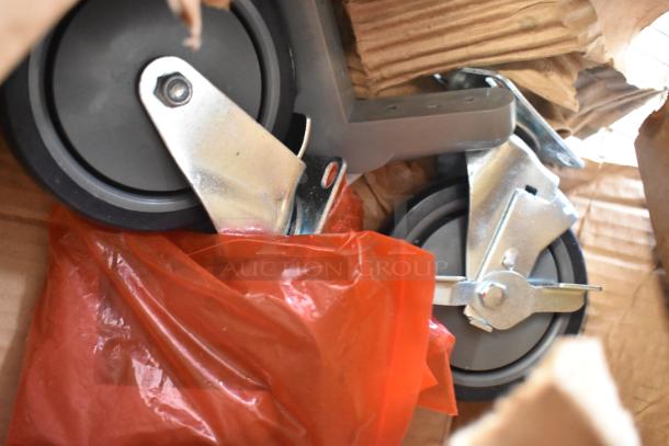 Brand new scratch and dent casters, including 2 TBH-18/23299 models, in original packaging.