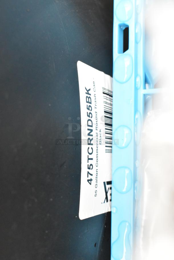 Label showing "475TCRND55BK Lavex 55 Gallon Black Round Commercial Trash Can" with barcode, on a wet black surface.