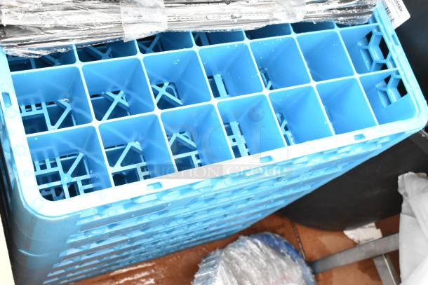 Blue stackable storage crate with dividers, holding wrapped metal items. Crate is wet, indicating recent cleaning.