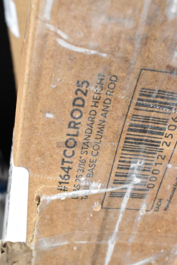 Cardboard box showing part of a label with text "164TCOLROD25" and barcode, indicating table base column model.