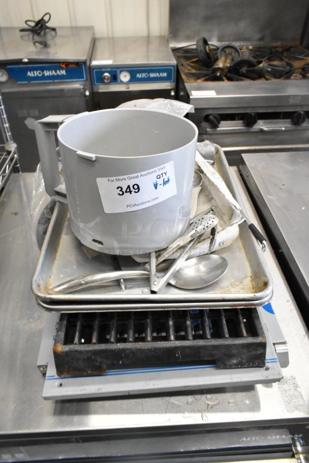 Lot of various kitchen items including a metal baking pan, utensils, and a food processor bowl. Item tag: 349.