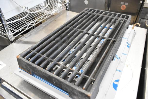 Lot of various items including a black metal grid, visible rust on edges, part of a mixed auction set.