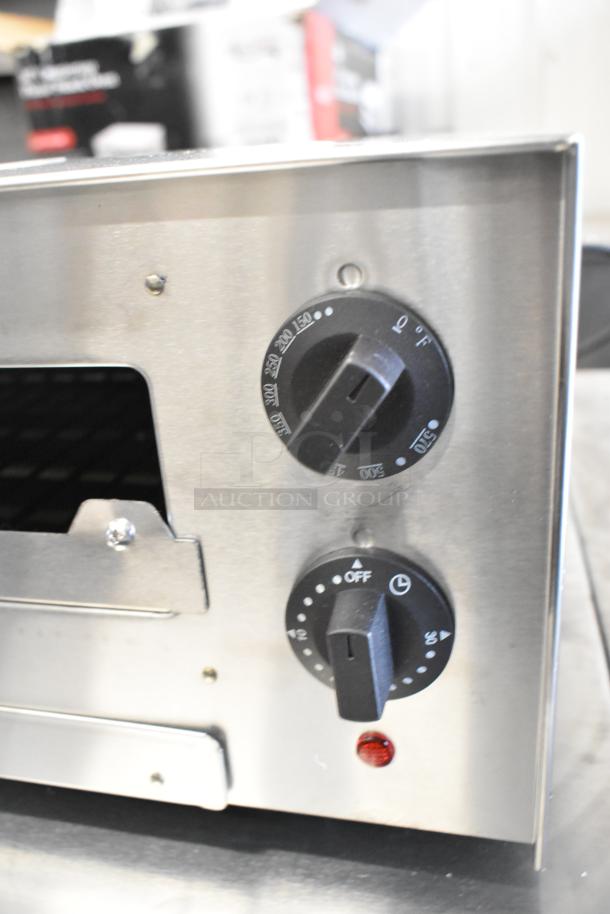 Brand new Avantco 177CPO16TSGL stainless steel countertop pizza oven, missing glass, with adjustable thermostatic control.