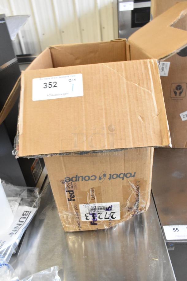 Brand new Robot Coupe 27213 in a marked box, showing exterior wear. Scratch and dent condition noted, packaging intact.