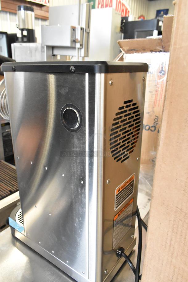 Brand new Bunn 55600.0100 GVH-1 bulk coffee grinder, scratch and dent, stainless steel, 120V, 1 lb. capacity. Warning label visible.