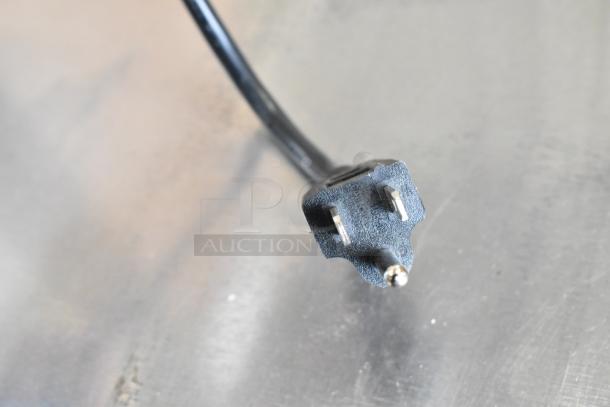 Close-up of a power plug for a Bunn 55600.0100 GVH-1 stainless steel bulk coffee grinder, 120 volts, 1 phase.