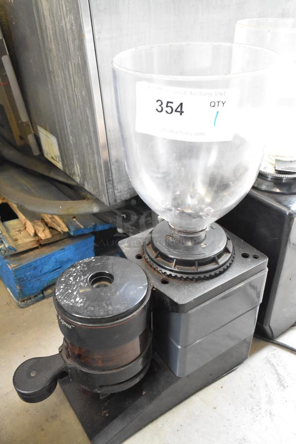 Bunn ES-1G metal countertop espresso bean grinder, no lid. 120 volts, 1 phase. Tag with "354, Qty 1." Used condition.
