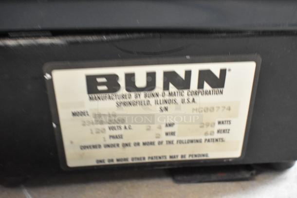 Bunn ES-1G metal espresso grinder, no lid, 120V, 1 phase. Label shows model, serial number MCG9774. Fair condition.