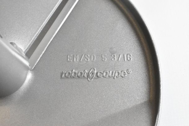 2 brand new scratch and dent Robot Coupe food processor blades, model EM/SD 5-3/16, logo and markings visible.