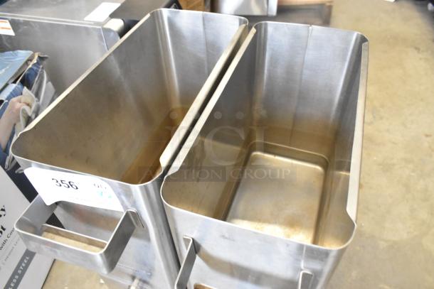 Two brand new stainless steel beverage dispensers, scratch and dent, with handle. Item tag number 356 visible.