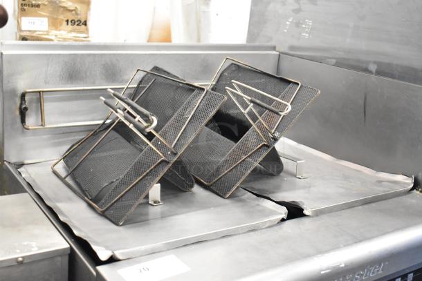 Frymaster PH255SC stainless steel commercial deep fryer with natural gas, 80,000 BTU. Features commercial casters, mesh baskets.