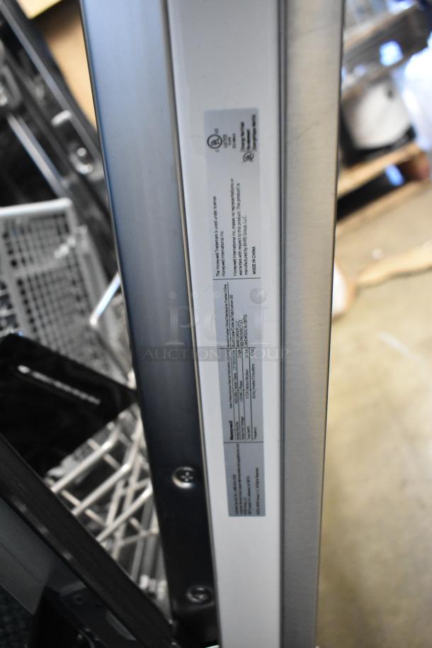 Stainless steel Honeywell HDS18SS undercounter dishwasher, 18" slimline, model label visible, brand new with scratches.