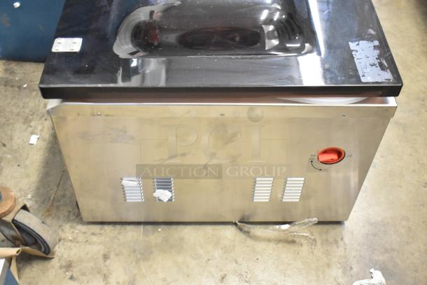 Brand new VacPak-It stainless steel commercial countertop vacuum sealer, scratch and dent condition, with visible control panel.
