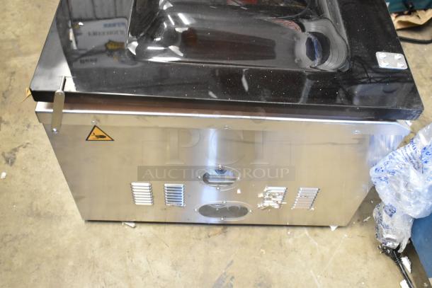 VacPak-It Stainless Steel Commercial Countertop Vacuum Sealer, brand new with scratch and dent marks, sleek design.