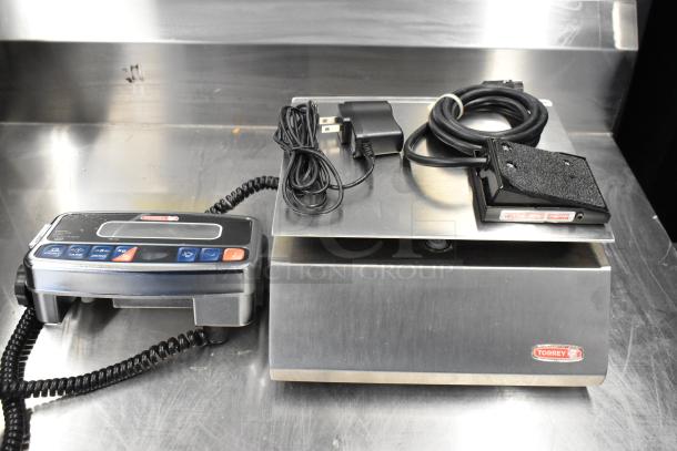 Brand new Tor Rey PPC-5/10 digital scale, 10 lb. capacity, remote indicator, foot pedal, legal for trade, slight dents visible.