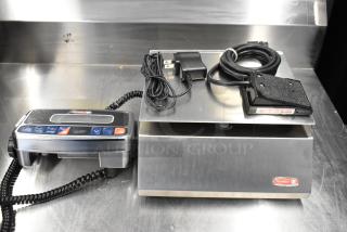 Brand new Tor Rey PPC-5/10 digital scale, 10 lb. capacity, remote indicator, foot pedal, legal for trade, slight dents visible.