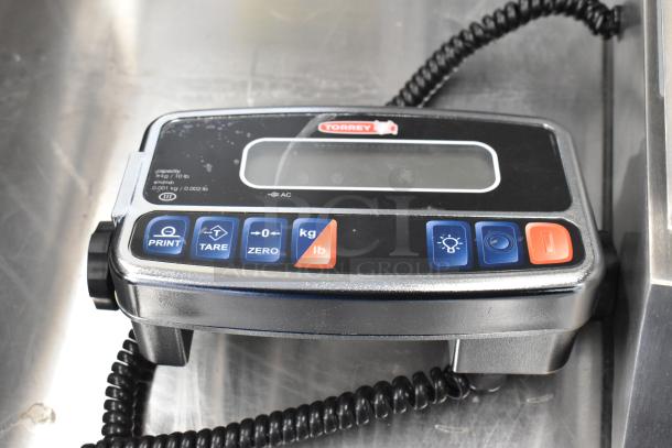 "New Tor Rey PPC-5/10 portion control scale, 10 lb capacity, remote indicator, foot pedal, legal for trade, minor scratches."