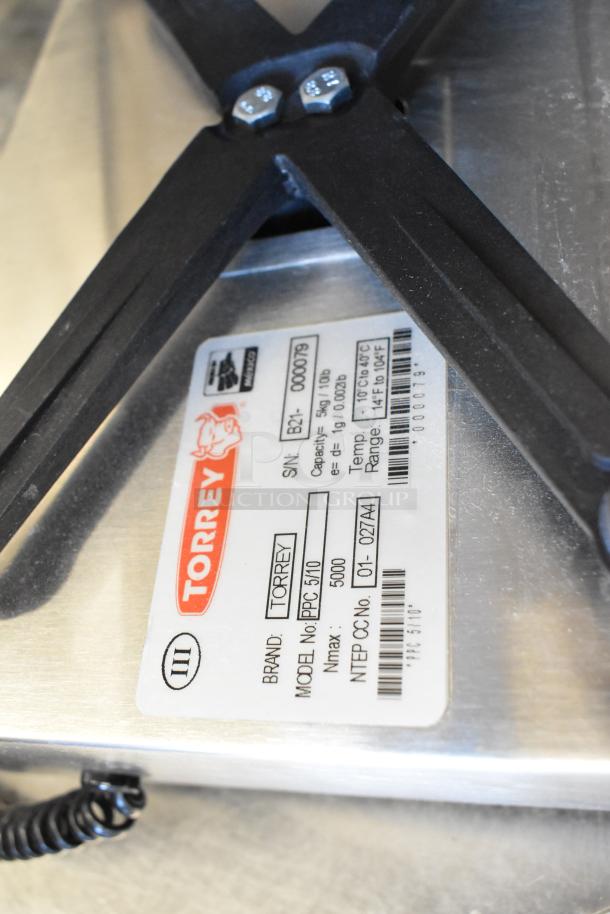 BRAND NEW Tor Rey PPC-5/10 digital scale, 10 lb. capacity, with remote indicator, foot pedal, legal for trade. Visible label details model, capacity.
