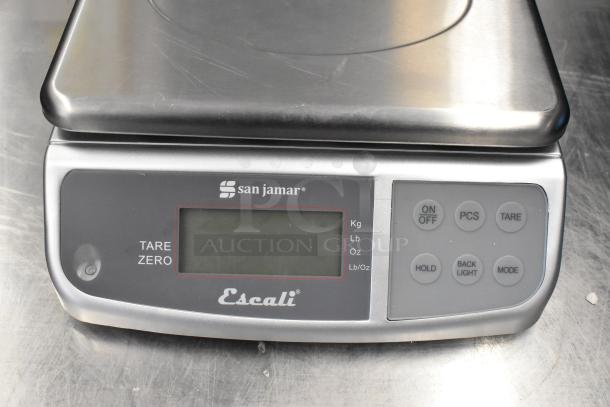 San Jamar Escali SCDGM33 33 lb. digital kitchen scale, brand new, with buttons for tare, mode, and backlight on stainless steel.