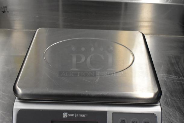 San Jamar / Escali SCDGM33 33 lb. digital kitchen scale, new, stainless steel, with visible brand logo and control buttons.