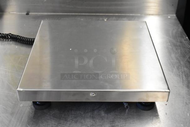 2 Brand New Scratch and Dent items: AvaTek RS150 150 lb. Digital Receiving Scale with Remote Display and San Jamar / Escali SCDGM33 33 lb. Multi-Function Kitchen Scale.