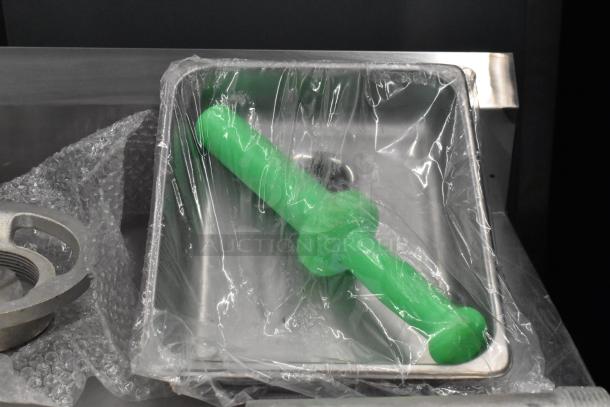 BRAND NEW SCRATCH AND DENT! Assure 190M22HGA meat grinder attachment with green stomper, wrapped in plastic, for #22 hub.