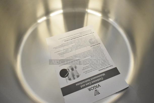Brand new Vigor 473SSPOT60 SS1 Series 60 Qt. stock pot, heavy-duty stainless steel, aluminum-clad, with care instructions.