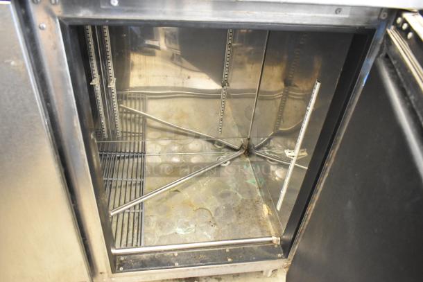 Perlick BR48 stainless steel commercial undercounter cooler, 2 doors, interior view, signs of use, 115 volts, 1 phase.